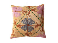 Unique suzani pillowcase 50x50 cm in sand-colored fabric with colorful vintage boho ethnic pattern of purple hearts, green tendrils and brown slings.